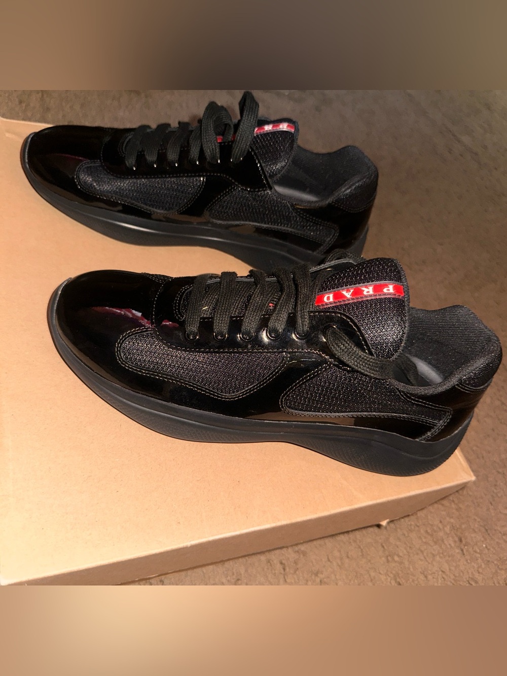 Prada Black Low-Top Sneakers with Red Logo Trim